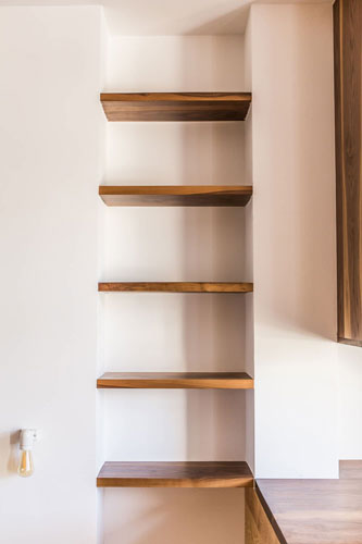 Wooden shelve system. Dark wood.