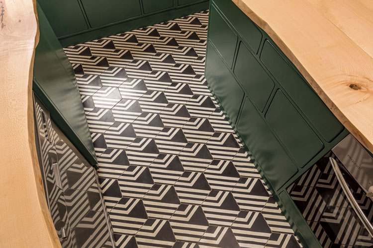 Bright wooden cabinet with dark wooden knobs and grain pattern. Close shot front.